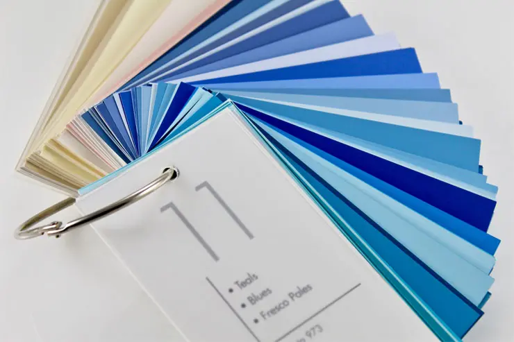 Various shades of blue samples in a color book.