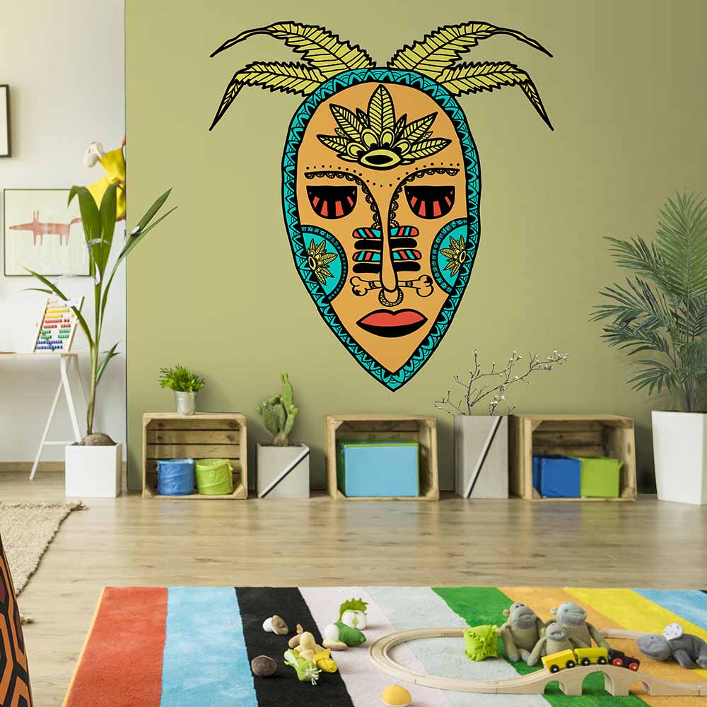 Tribal mask-themed wallpaper in a playful kids' playroom.