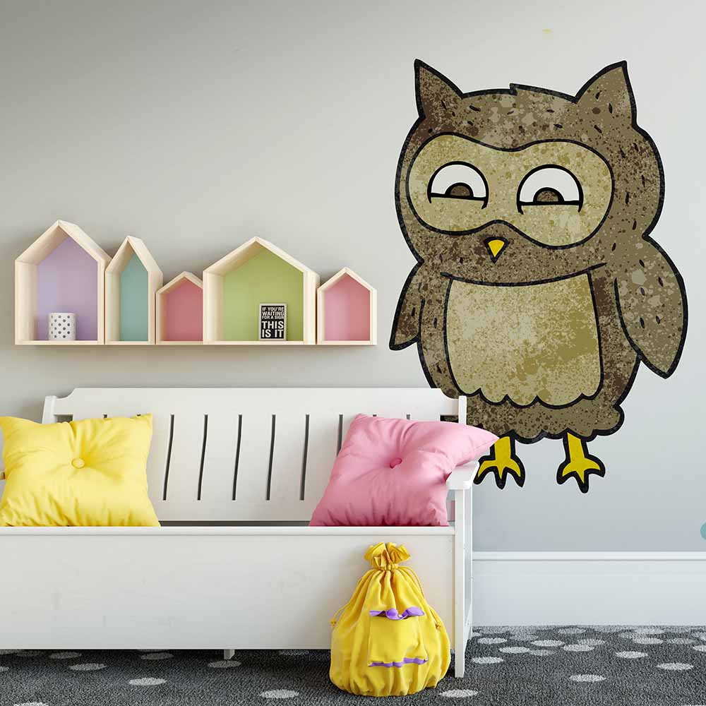 Playful owl wallpaper in a cozy kids' seating area.