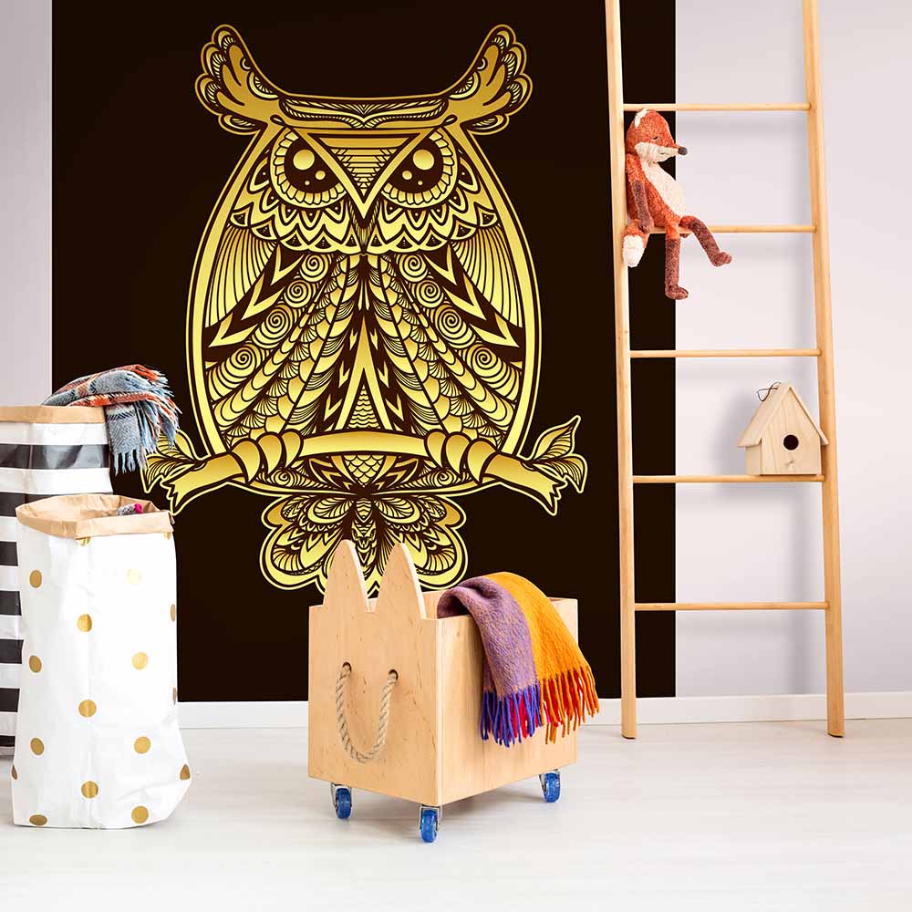 Golden owl mural wallpaper in a stylish kids' playroom.