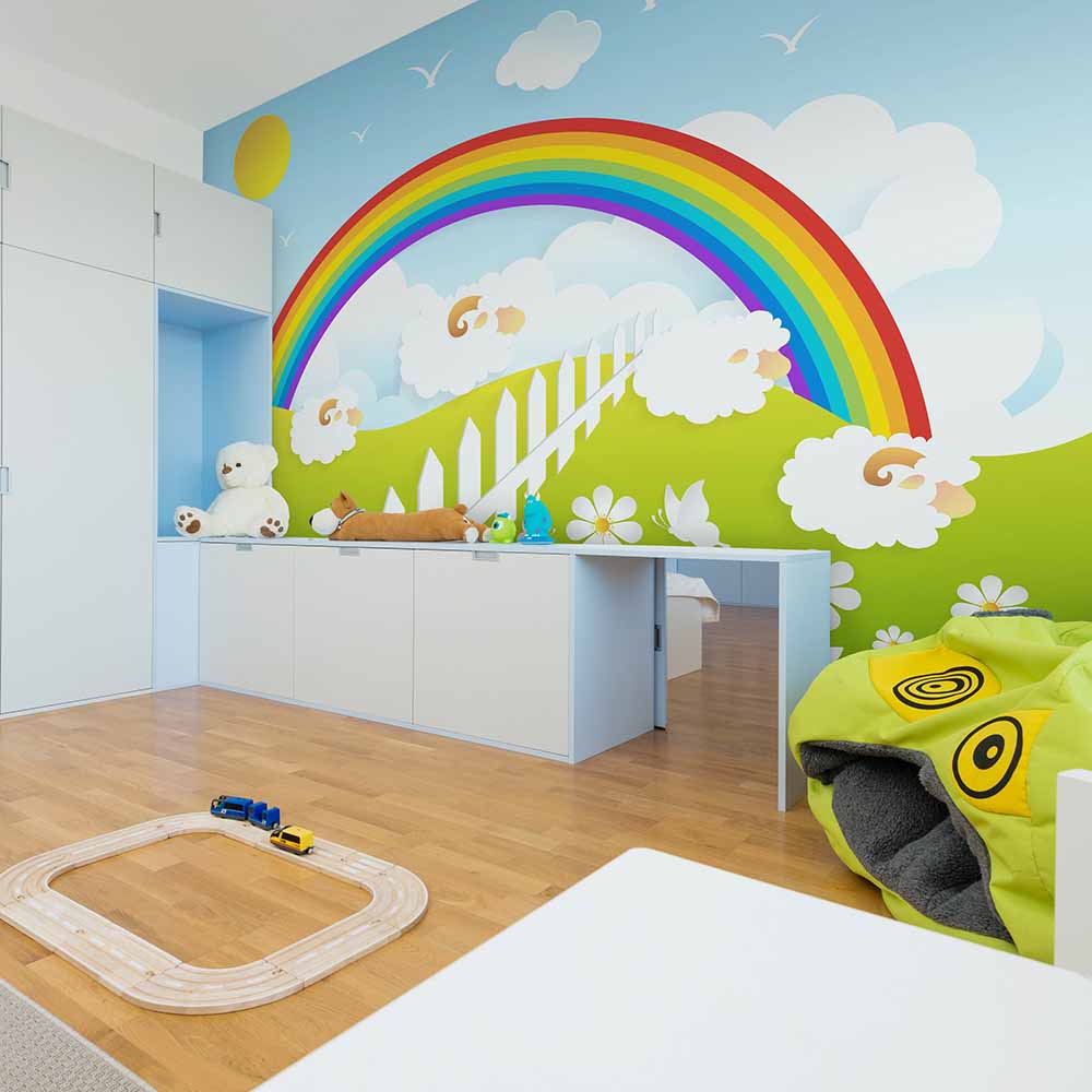 Vibrant rainbow-themed wallpaper brightens a kids' playroom.