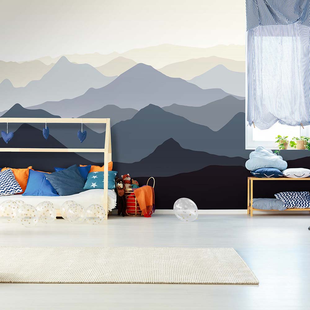 Mountain-theme wallpaper creates a cozy kid's room.