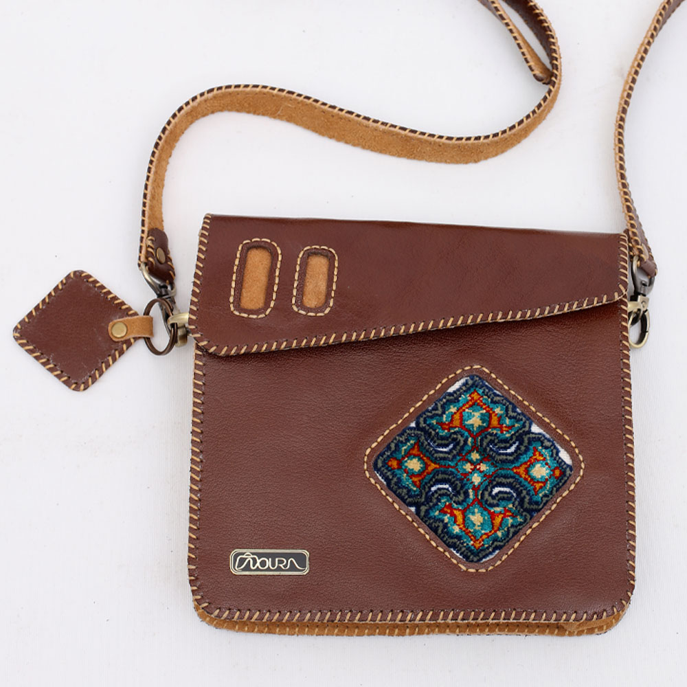 Brown crossbody bag with diamond woven panel.