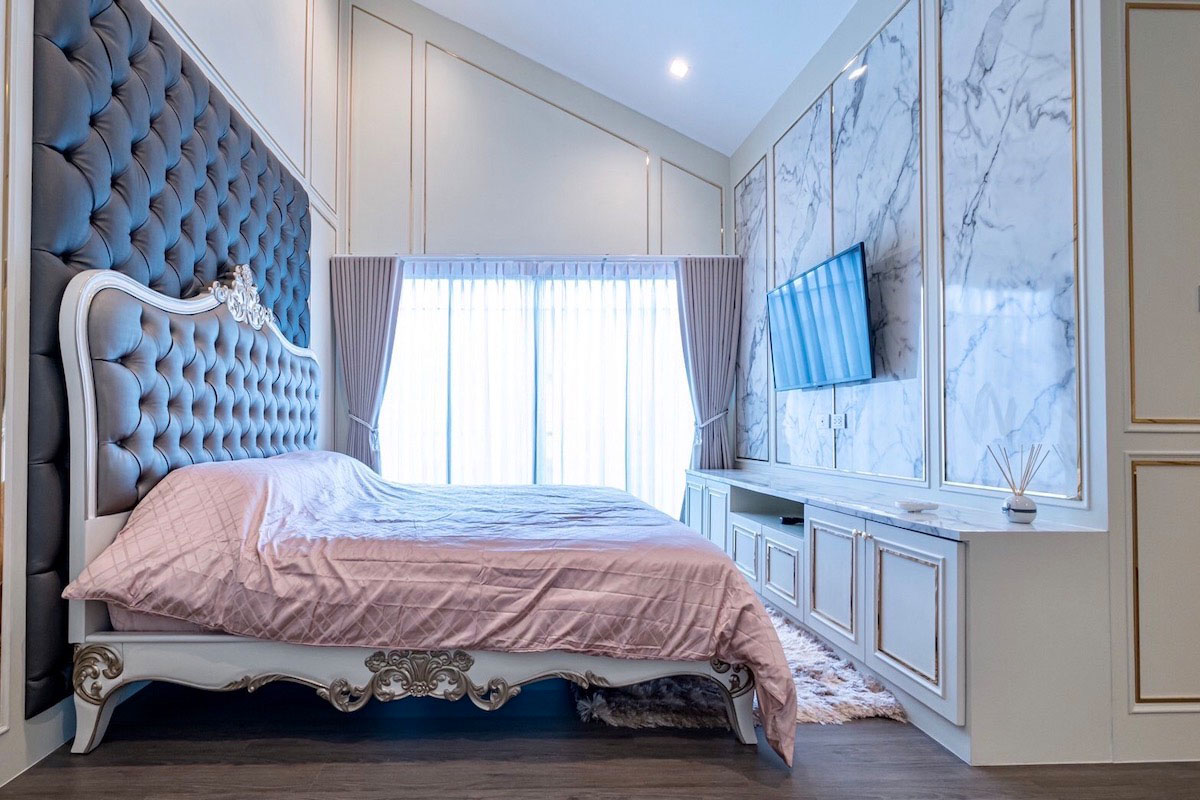 Luxury Bedroom with Marble Accents Wall.