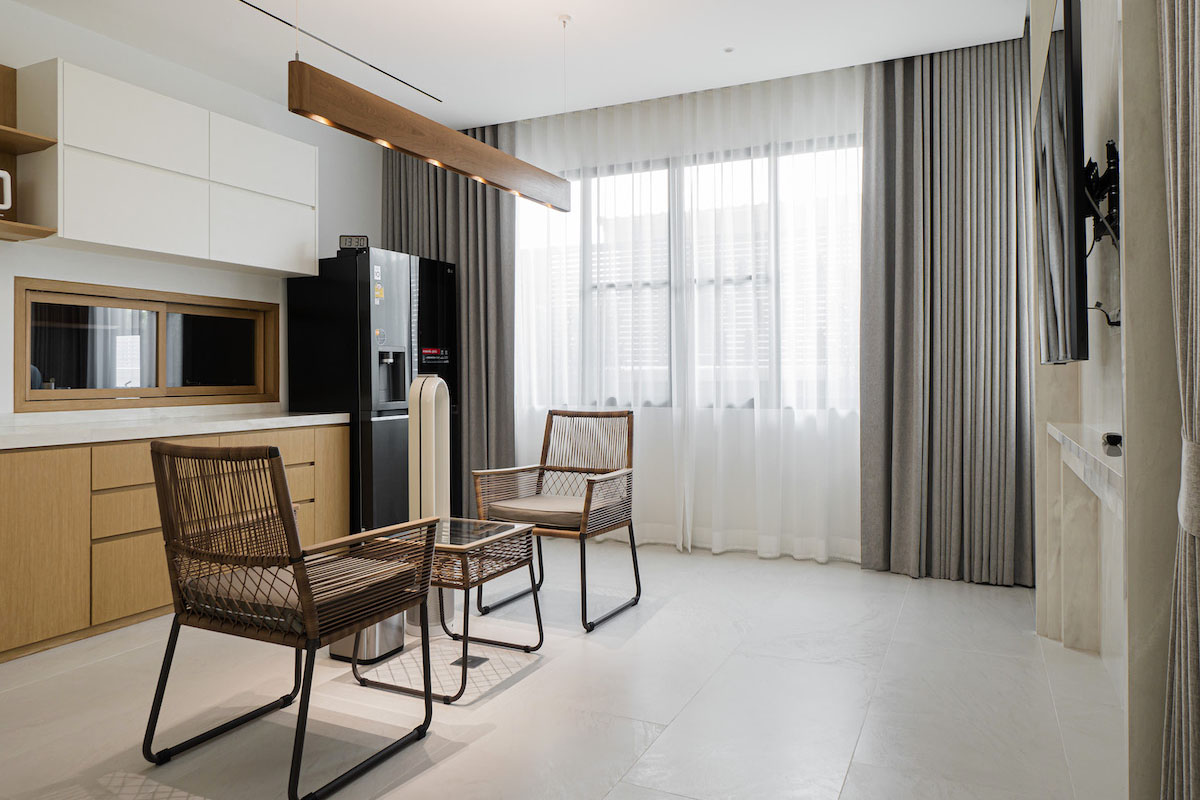 Modern Kitchen Dining Area with Sheer Curtains.