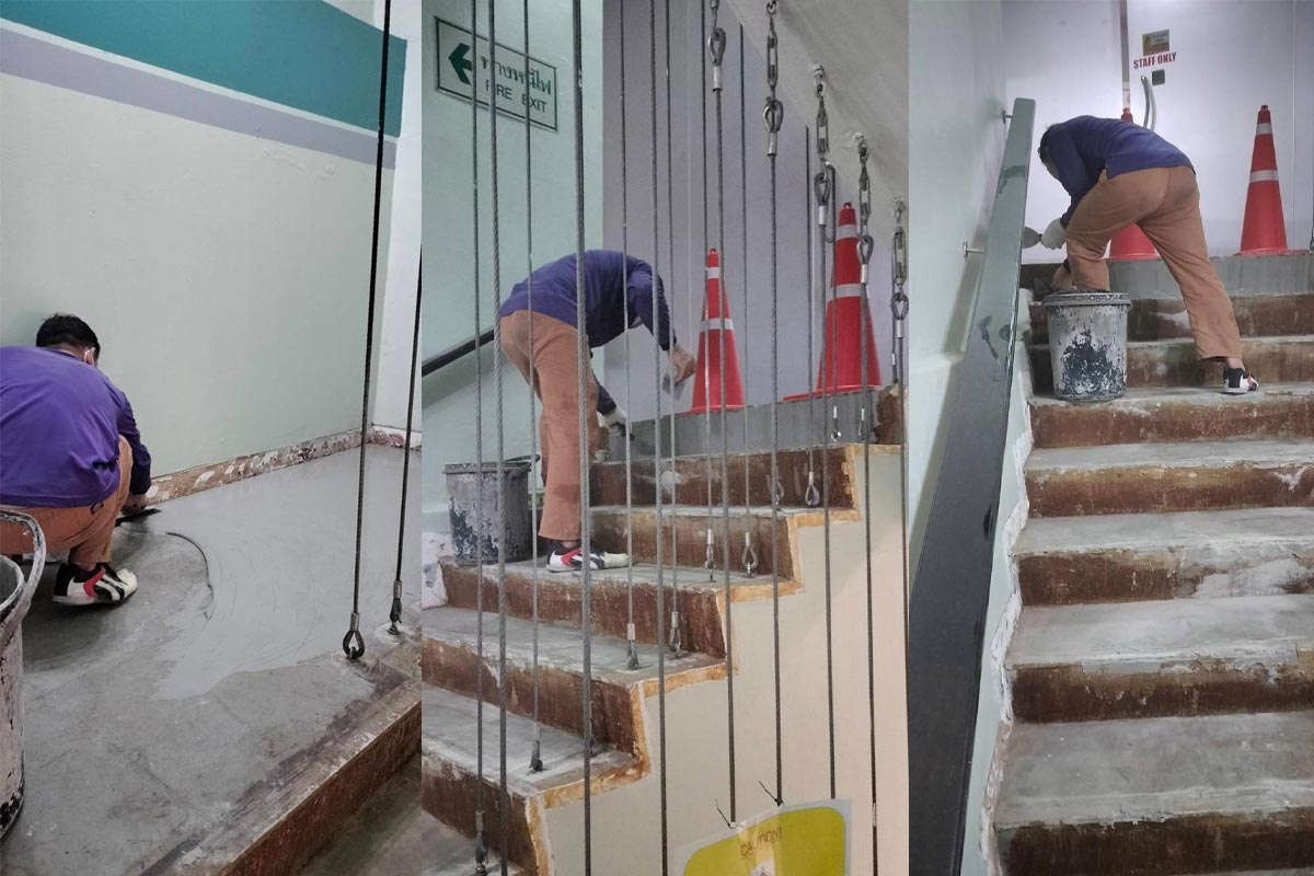 Surface leveling and staircase repair in progress at Cormix Bangkok office before SPC flooring installation.