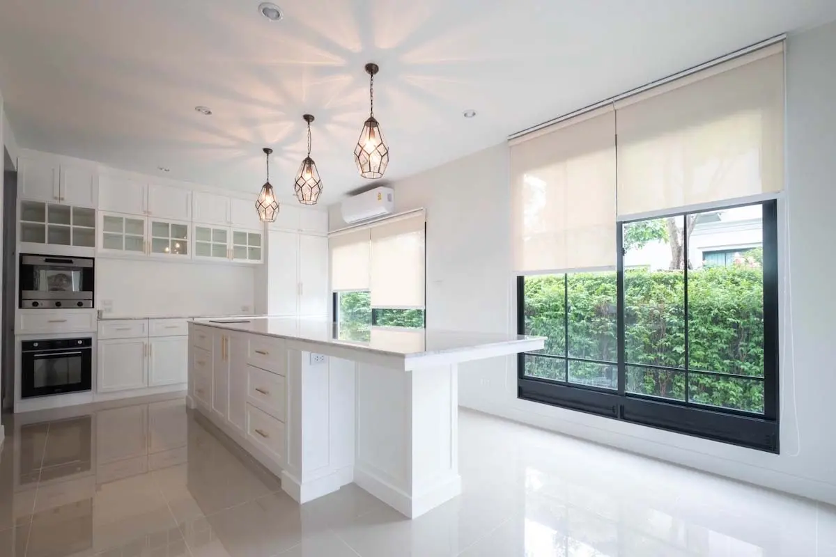 Living room with roller shades on the window