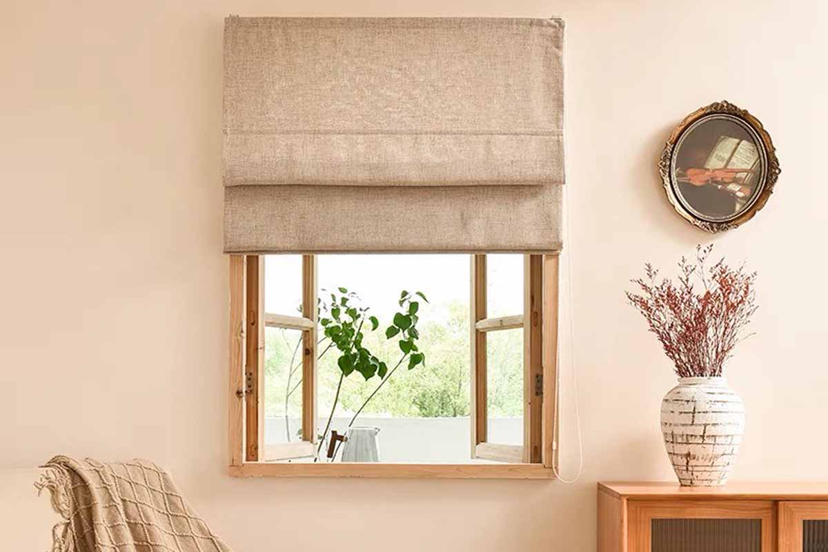 Linen fabric Roman shades decorated a small window.