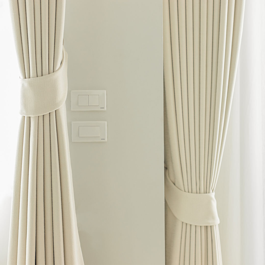 Off-white warm color blackout curtains.