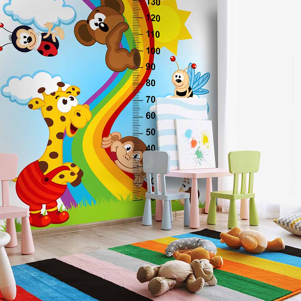 Rainbow-themed growth chart wallpaper for kids' playroom.