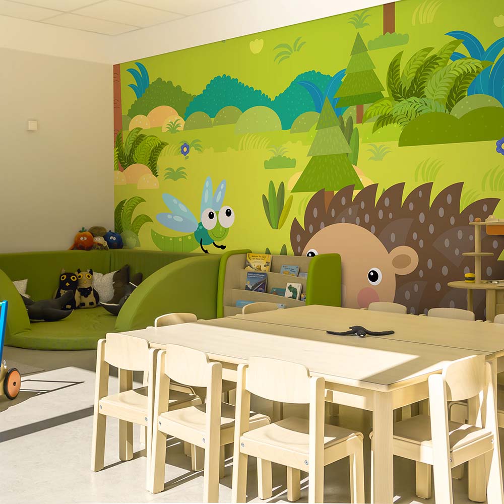Forest-themed kids' playroom wallpaper.