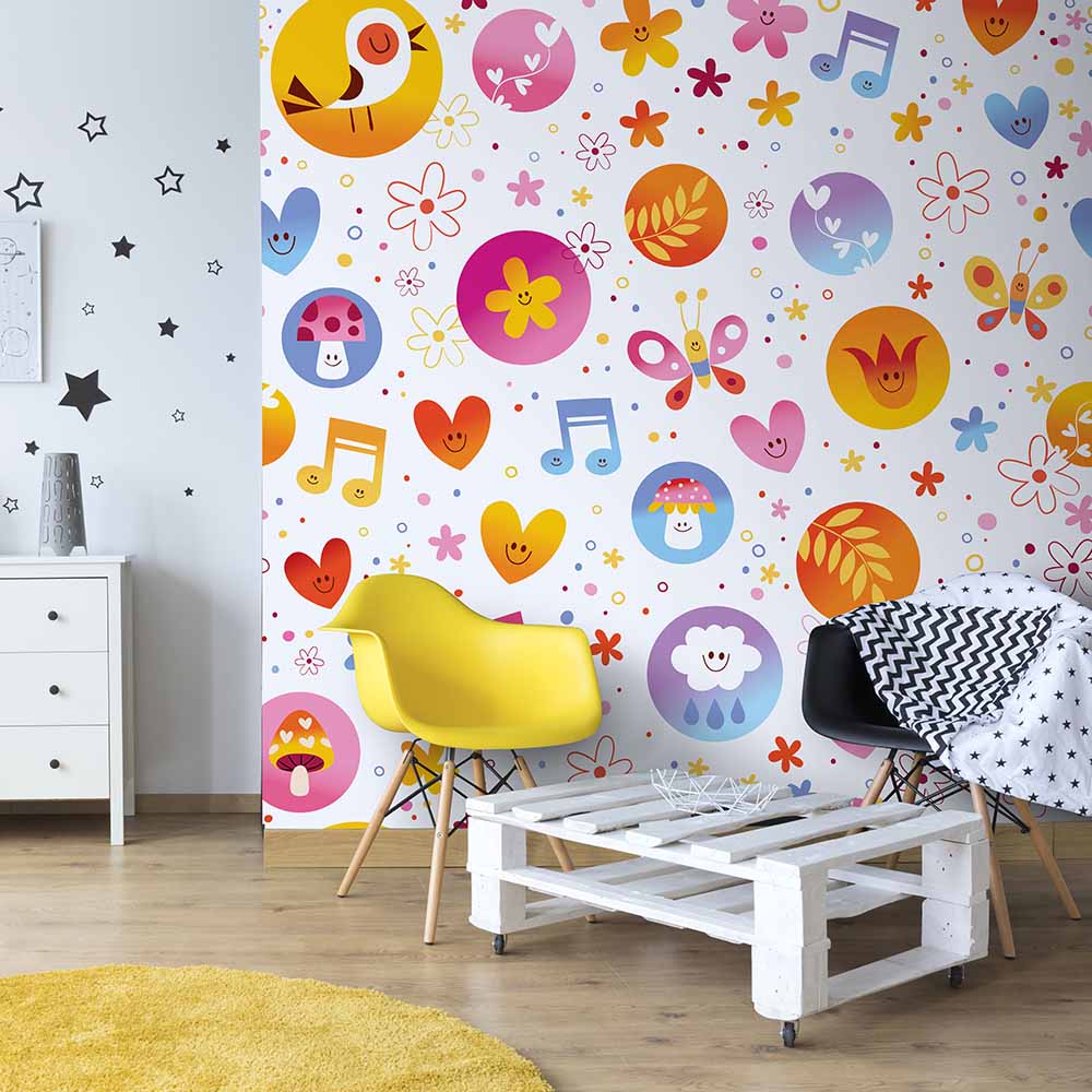 Playful wallpaper with cheerful icons creates a lively playroom.