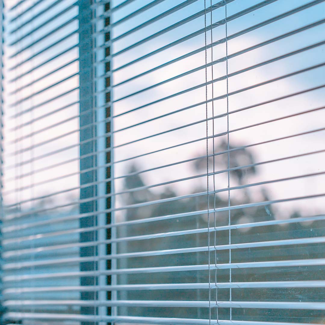 Aluminum blinds for office windows.