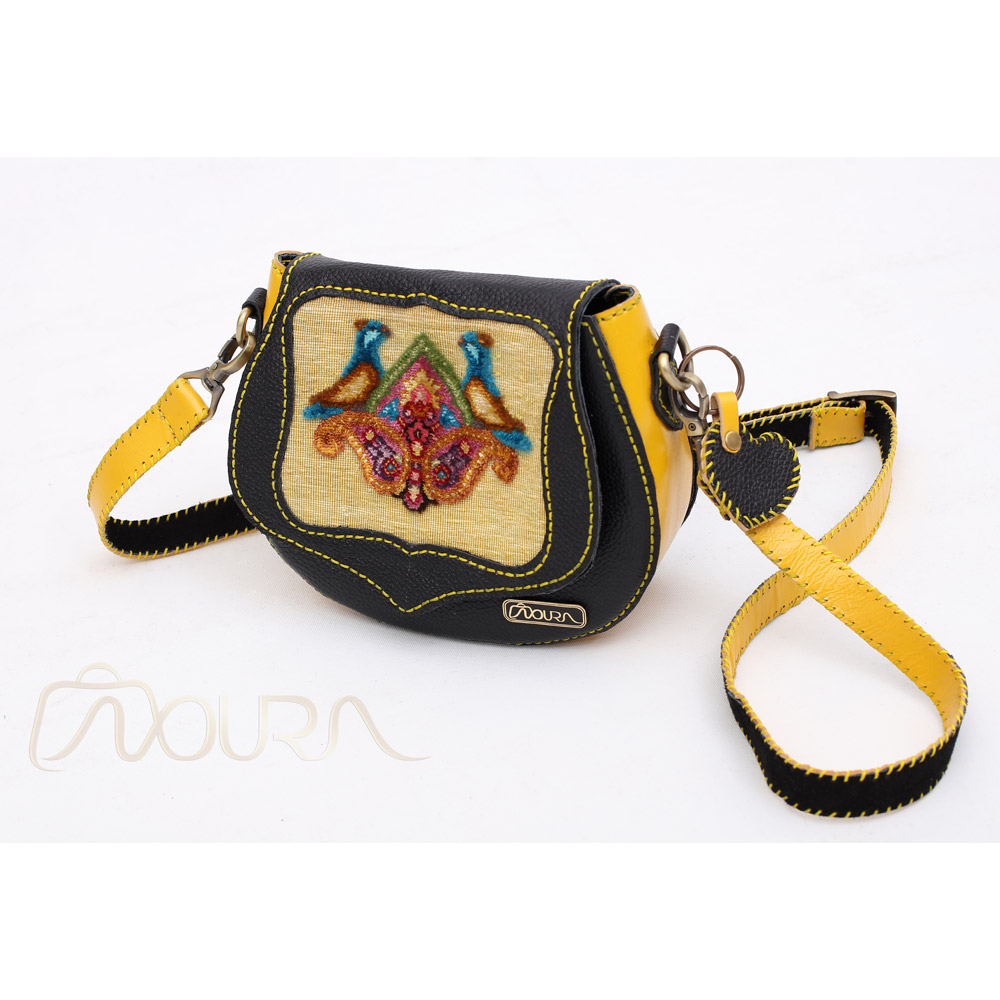 Black-and-yellow crossbody bag with woven bird motifs.