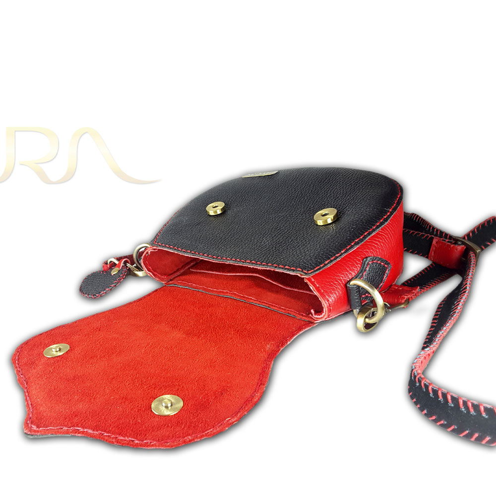 Open red-and-black crossbody bag with gold clasps