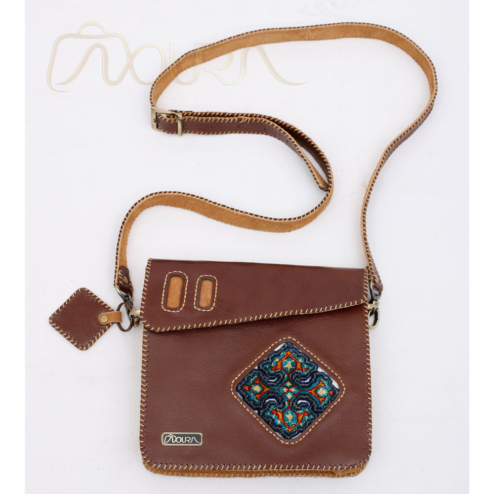 Brown leather crossbody with diamond woven motif.