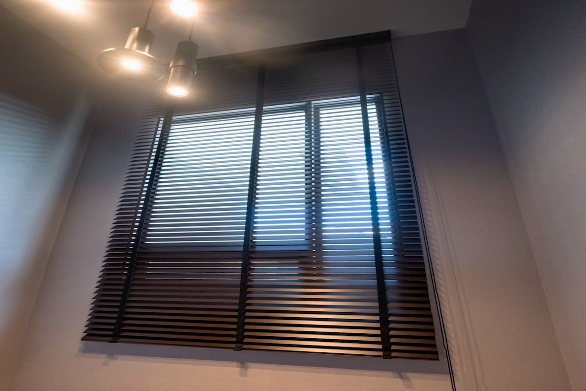 Wooden blinds in stairwell.