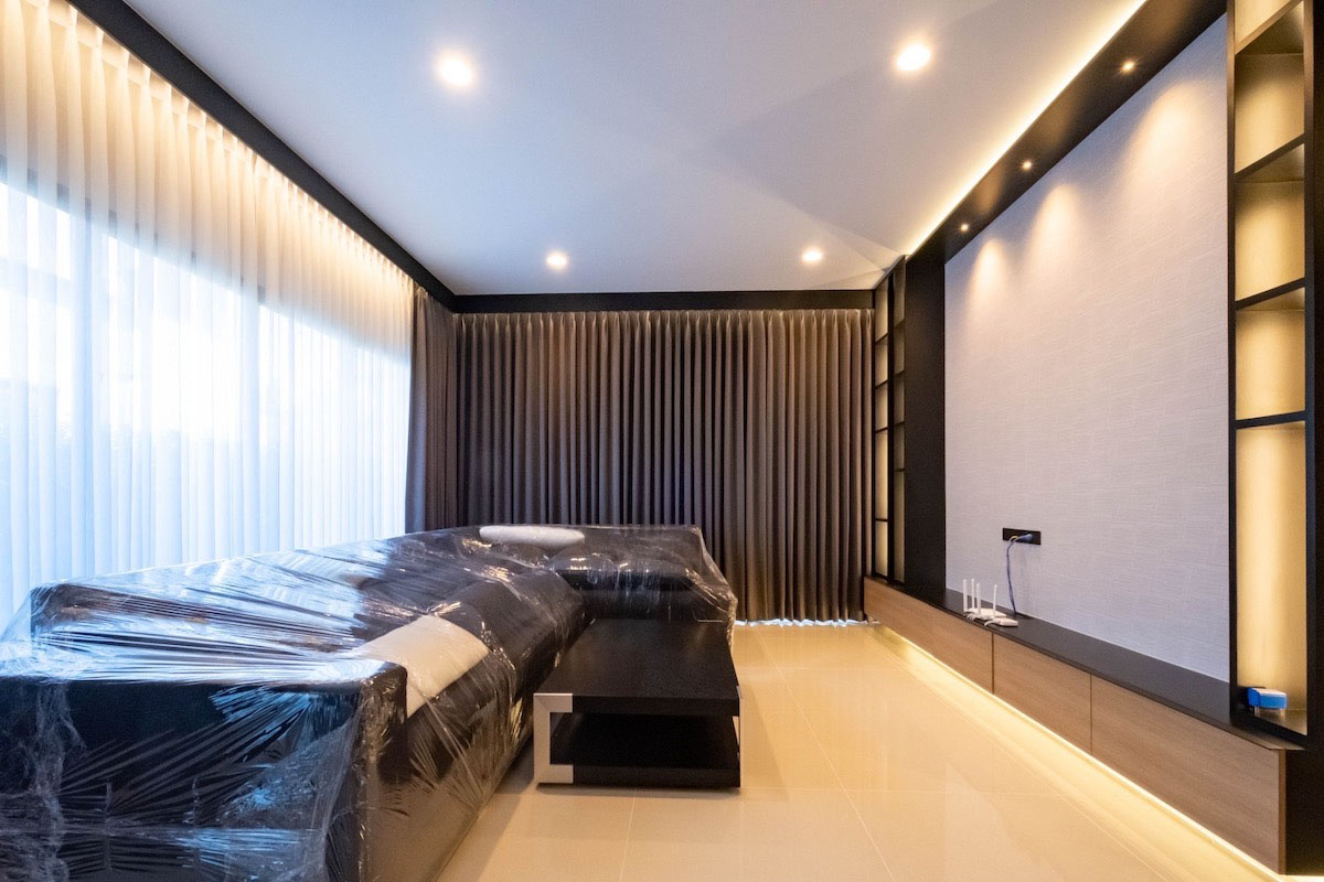 Common area with double layered curtains.