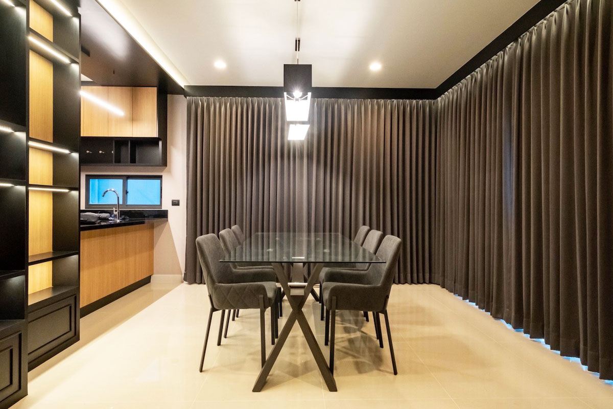Dinning room with blackout curtains.