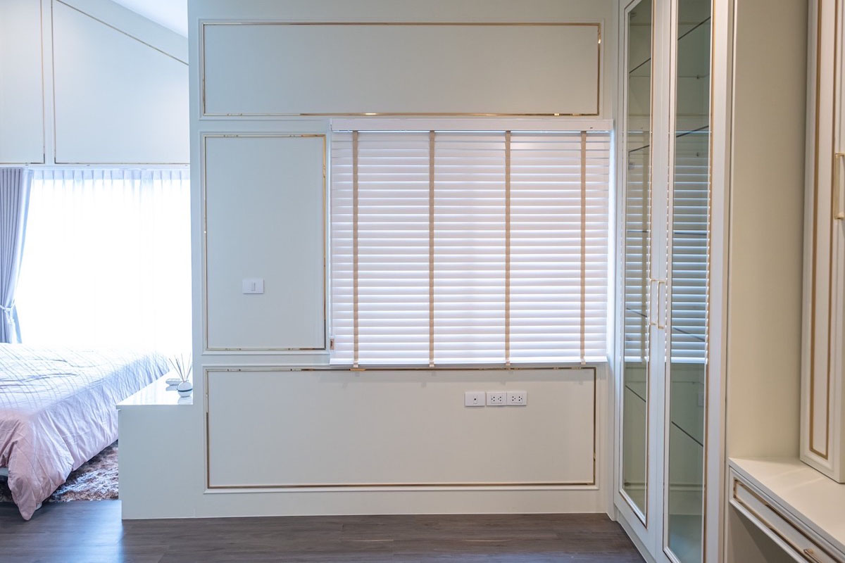 Sleek Window Blinds in a Calm Bedroom Setting.