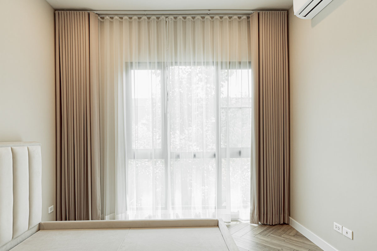 Sleek Design with Elegant Curtains in a Minimalist Bedroom